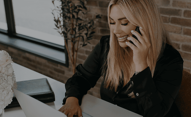 Blonde woman on phone providing dedicated support
